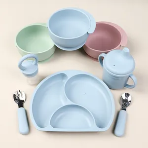 Top view of 8-piece silicone baby feeding set with suction bowls, plate, and cutlery