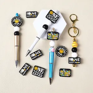 DIY bead pen set featuring smiley faces and One Happy Mom silicone charms on metal pens