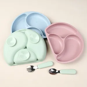 Silicone baby dining set with suction plates and stainless steel utensils in soft colors