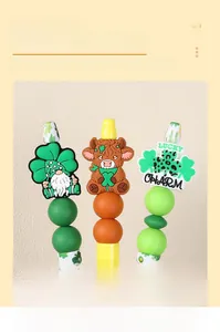Macro shot of St. Patrick's Day silicone beads with gnomes and lucky charms