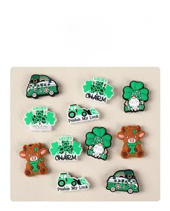 Detailed view of St. Patrick's Day PVC charms including shamrock, gnome and lucky charms