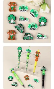 Macro detail of St. Patrick's Day silicone gnome and highland cow beads for DIY pen set