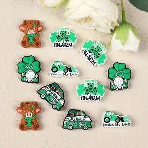 St. Patrick's Day shoe charms featuring Highland cow, lucky gnome, and green clover designs
