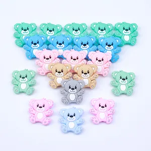 Close-up of colorful bear silicone beads for DIY pacifier clips in various pastel shades