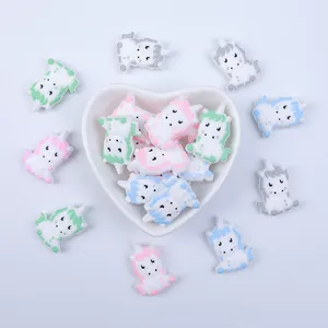 Macro detail of colorful silicone unicorn beads for DIY baby pacifier clips and teethers