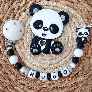 Close-up of silicone panda teether with personalized Hugo letter beads pacifier clip