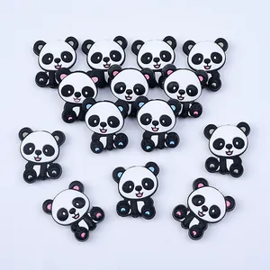 Flat lay of cartoon panda PVC charms for DIY shoe accessories and phone cases