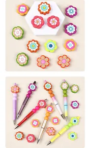 Detail of colorful flower silicone beads and DIY beaded pens with gradient finishes
