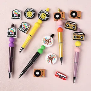 DIY bead pens set featuring music and gaming themes with colorful silicone beads