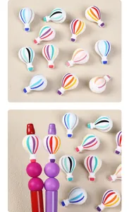 Close-up of 3D hot air balloon silicone beads used as colorful DIY pen topper accessories