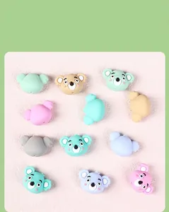 Macro shot of 3D cartoon koala silicone beads in multiple pastel colors for DIY jewelry