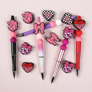 Stylos à perles en silicone DIY avec thèmes 90s Baby et Girl Power sur fond rose
