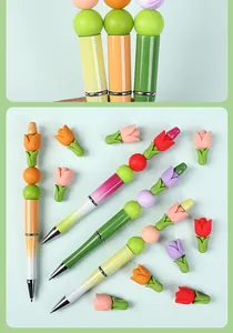 Detail of 3D tulip silicone beaded pens with vibrant flower shapes and gradient barrels