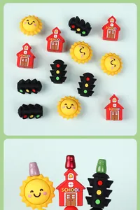 Detail of 3D silicone cartoon sun and school charms used as creative pen toppers