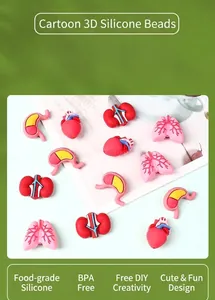 Macro view of BPA-free 3D silicone beads in organ shapes like heart and lungs for DIY crafts