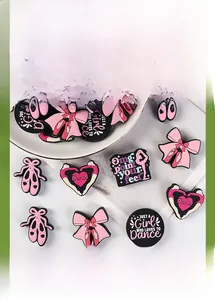 Macro detail of dance-themed silicone beads with ballet shoes and bow for DIY jewelry making