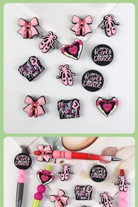 Detailed close-up of ballet-themed silicone charms and beads for DIY jewelry and pens