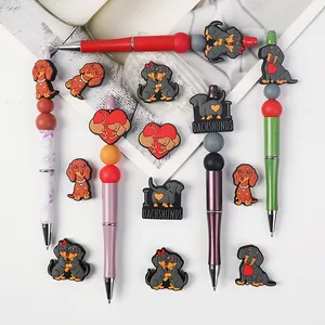 Juego de bolígrafos de Teckel con cuentas de silicona de colores y dijes de perro