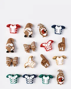 Detailed view of American football themed PVC shoe charms with jerseys and gnomes