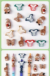Detail of football-themed silicone charms and jersey beads used for DIY pen decoration