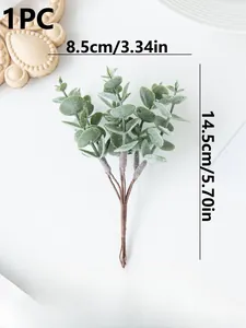 Detailed view of artificial eucalyptus leaf spray with frosted texture for home decor