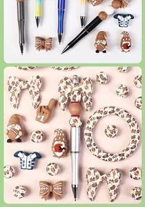 Detail of football-themed silicone beads and DIY metal beadable pens for creative jewelry