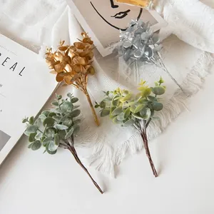 Artificial eucalyptus leaves in gold, silver, and green for modern home vase decoration