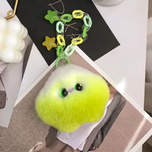 Furry gradient monster bag charm with neon green plush and star chain accessory