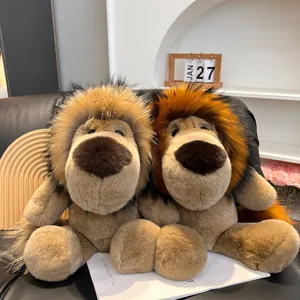 Detailed view of two plush lion dolls with brown fur and colorful manes on a sofa