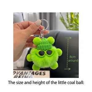 Detail of 8cm bright green plush keychain with mini knit hat and cute sunglasses