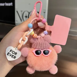 Pink plush bear charm with sunglasses, striped beads, and heart tag on a chain