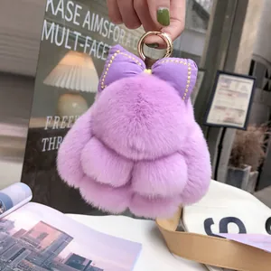 Cute purple real rabbit fur bunny keychain with bow charm on a golden metal ring