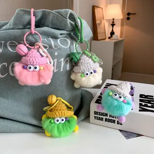 Cute faux rex rabbit fur monster keychains with colorful knit hats on denim bag