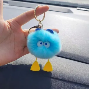 Blue plush monster keychain with cute duck feet and golden clasp for car bags