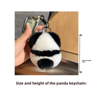 Detailed view of a 12cm plush panda keychain made of soft fur with black metal clip
