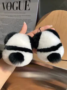 Detailed view of plush panda accessories with fluffy faux fur and elastic cord loops