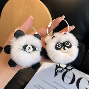 Detail of cute panda plush keychain with soft faux rabbit fur and steel wire loop