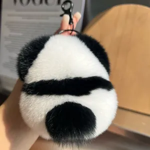 Cute panda plush keychain made of fluffy fur with black carabiner for bags and keys