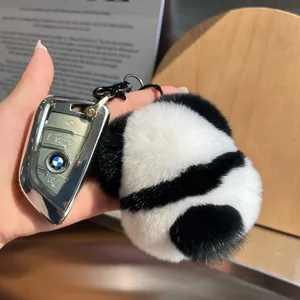 Panda plush keychain made of Rex rabbit fur hanging on a car key with metal clasp