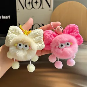 Cute faux rabbit fur plush ball charm with a bow tie and googly eyes for backpacks
