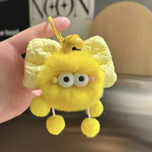 Creative yellow faux rabbit fur plush ball keychain with a plaid bow and bells