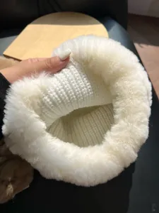 Detail of white rex rabbit fur hat with thermal knit lining for winter warmth