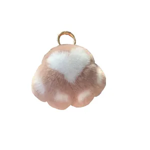 Cute pink plush cat paw keychain with white heart design and gold metal hook