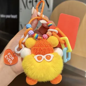 Cute yellow plush fur keychain ball with orange beanie and sunglasses for bags