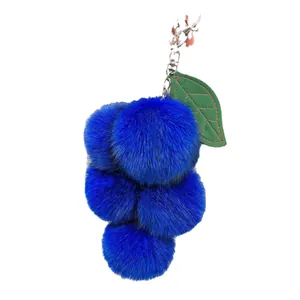 Portachiavi uva in pelliccia di volpe blu con pompon morbidi e anello in argento