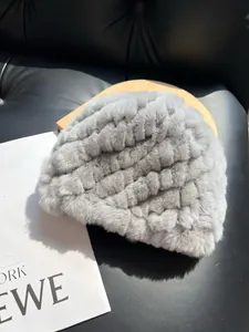 Macro detail of the light gray faux fur texture with elegant wavy knit patterns on the hat