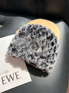 Detail of plush faux fur texture on a thick winter hat with leopard print pattern