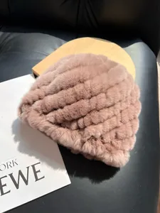 Macro view of thick brown faux rabbit fur texture on a warm winter knitted beanie cap