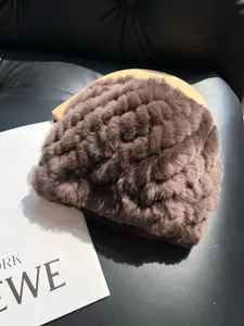 Detail of dark coffee rabbit fur hat with thick plush texture and ribbed knit design