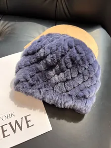 Detailed close-up of violet rex rabbit fur hat showing soft textured wavy patterns